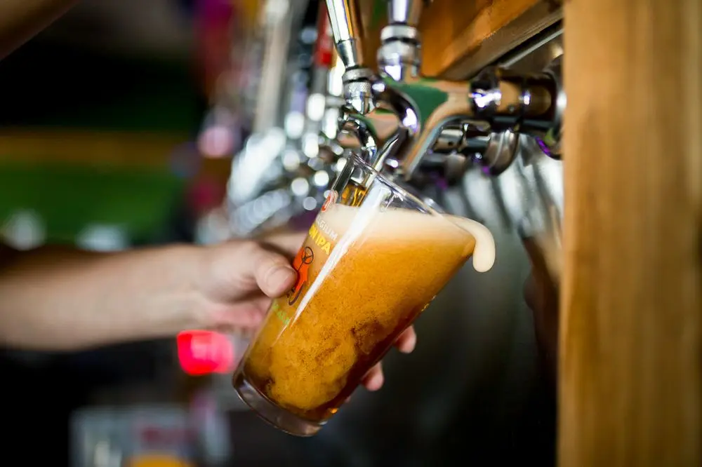 A fresh beer being poured from the taps at Pflutto's Tavern